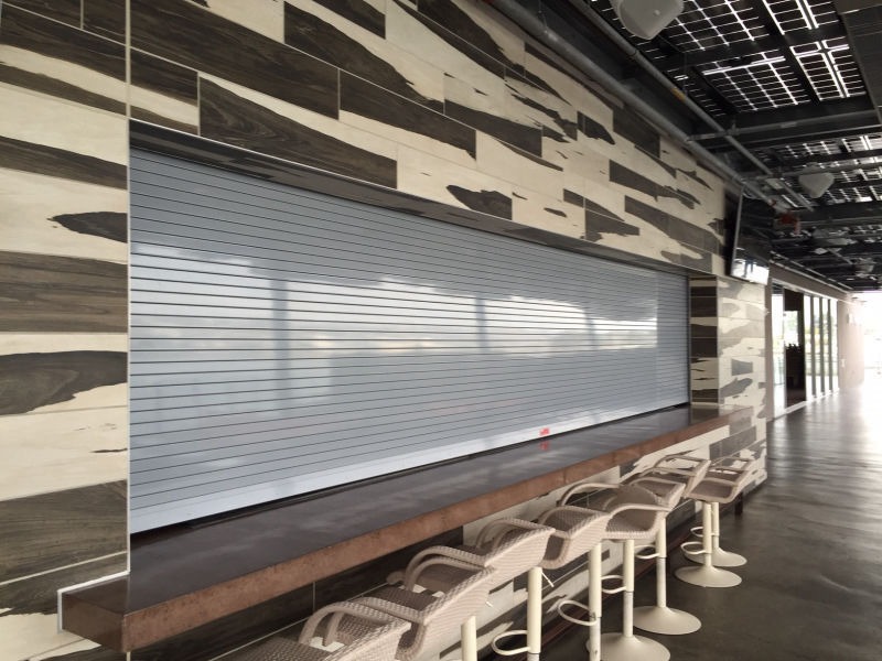 The Insulated Counter Rolling Door provides the additional benefits of thermal and air filtration control to all the benefits the Heavy Duty Counter Door provides.  It is the appropriate counter door for openings with heavy daily operations that needs high resistant against vandalism plus the insulated factor; this door is also capable to withstand Hurricane Pressures and can be ordered for manual or motor operation.