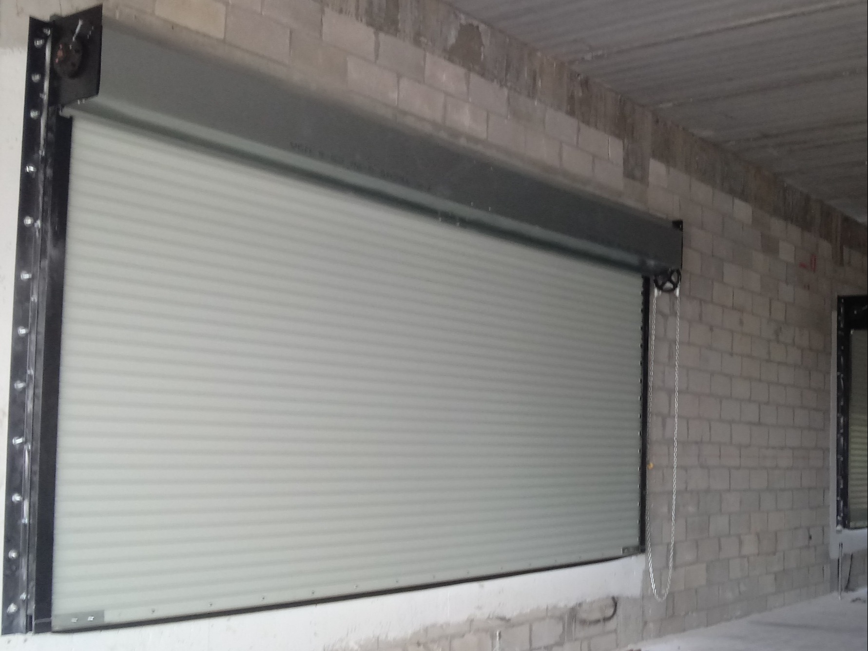 Our Model 2670 Oversize Heavy Duty Rolling Doors are designed for those openings with big dimensions, providing safety, great performance and a nice appearance for your building. Built with high quality materials for durability and reliability, the doors can be constructed to meet and exceed the very stringent High Velocity Hurricane Zones (H.V.H.Z) requirements of the current edition of the Florida State and Miami Dade Building Code.